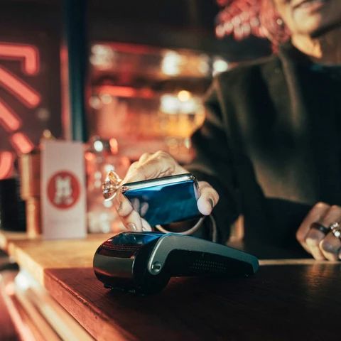 Woman makes mobile payment digital only