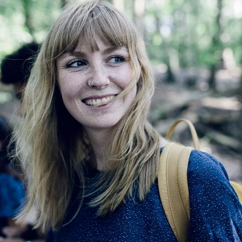 Young woman on way to lake with friends