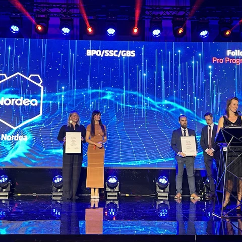 people on stage receiving an award
