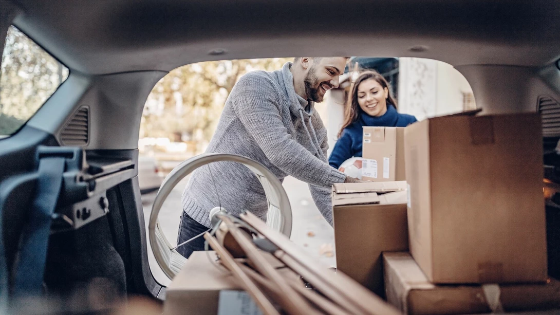 Couple unloading a moving van