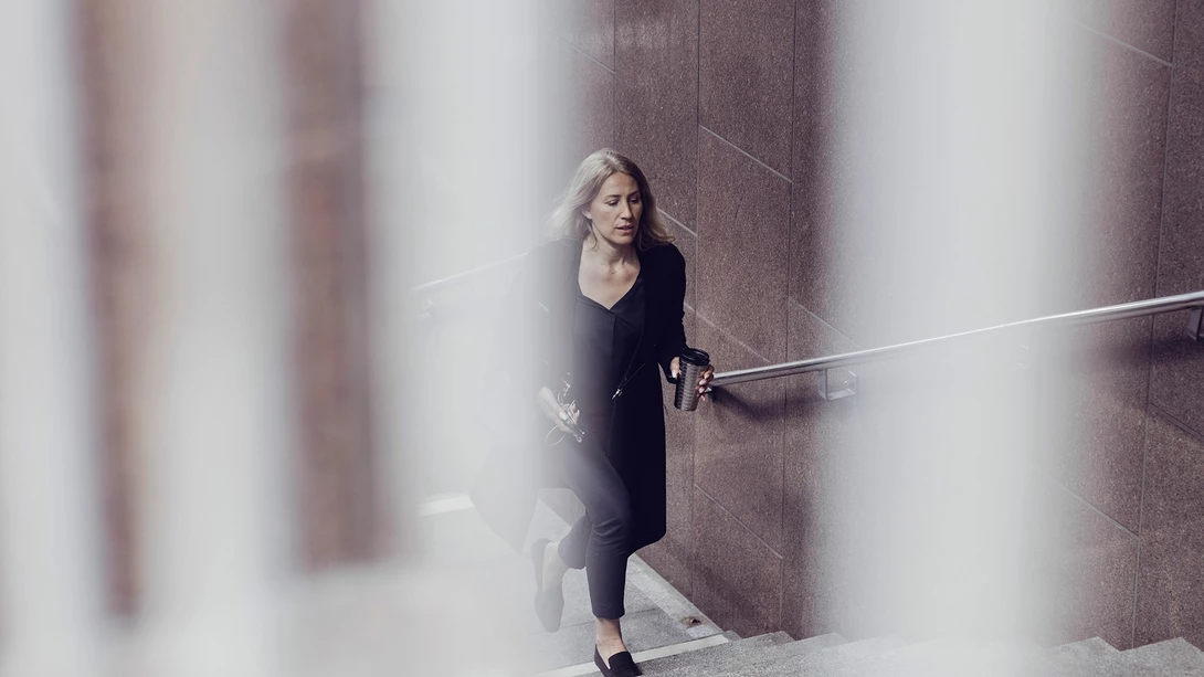 Woman walking up stairs