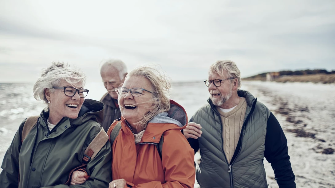 Seniors walking on the beach